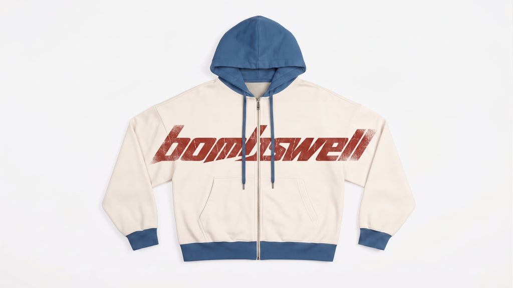 Sudadera con cremallera colorblock crema y azul con wordmark bombswell grande en el pecho