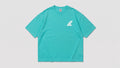 Camiseta oversize turquesa con logo fin Bomb Swell en el pecho