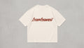 Camiseta oversize color crema con logotipo bombswell en tinta rust en el pecho