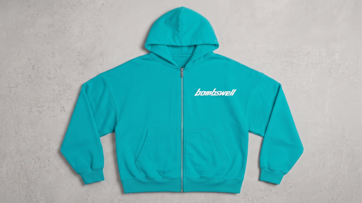 Sudadera con cremallera oversize turquesa con logotipo bombswell en el pecho